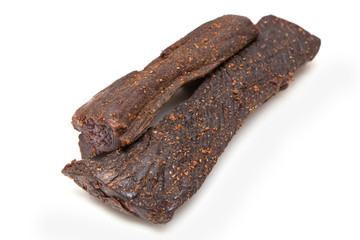 Beef Biltong, South African Beef Jerky isolated on a white studio background.