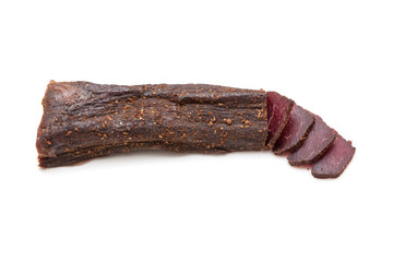 Beef Biltong, South African Beef Jerky isolated on a white studio background.
