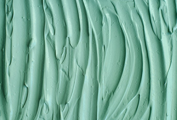 Green cosmetic clay (kelp facial mask, face cream, spirulina body wrap) texture close up, selective...