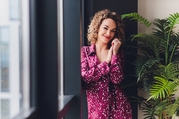 Woman on Hotel Bed Covering Self With Sheet.