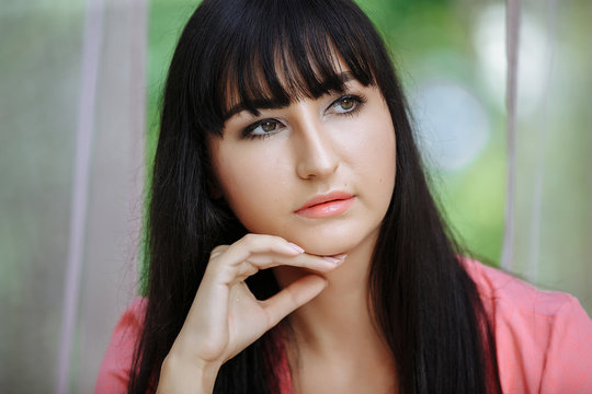 portrait of a girl in a pink dress in tulles
