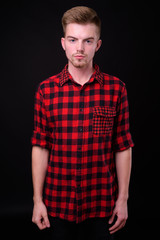 Obraz premium Portrait of young handsome blond bearded hipster man