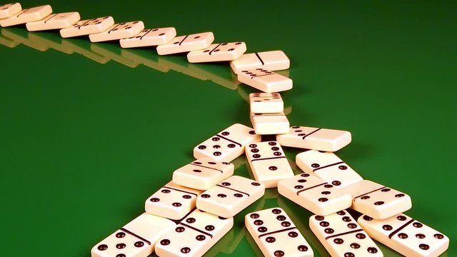 Domino Effect Illustrating the Chain Reaction of Economic Collapse, High Unemployment, Business Failures, and Stocks Crashing in a Bear Market Economy