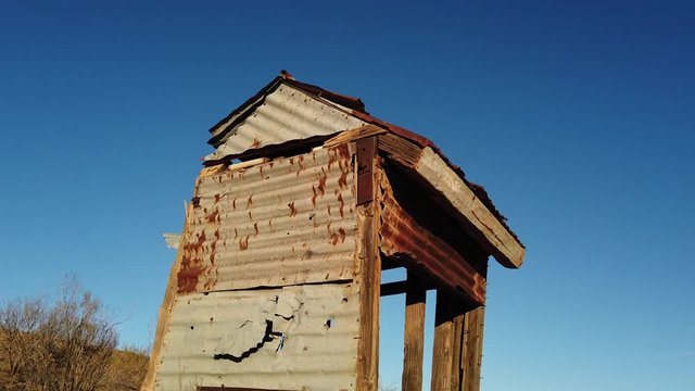 Outback dunny on the side of a hill