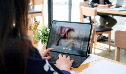 woman using laptop making video call to her partnership about plan in video conference.