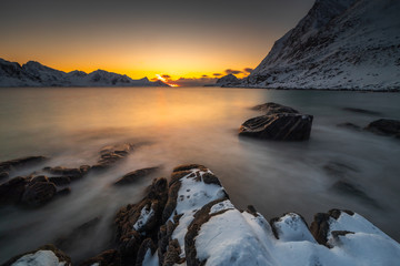 View of amazing Lofoten Islands winter scenery with mountains and fiords in beautiful golden morning light at sunrise, Norway