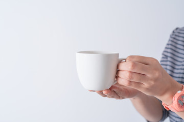 hand holding a cup of coffee on white background isolate, Asia woman hand with white coffee.