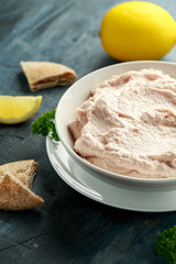Taramasalata dip made with fish roe in white bowl