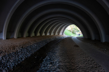 river flowing under a round bridge