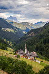 Fototapeta na wymiar A view of mountain village in Dolomites, Italy