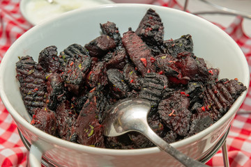 Sliced baked beetroot in bowl 