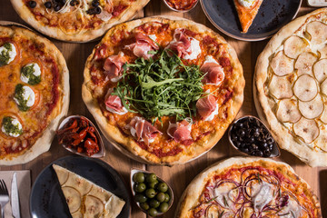 Freshly served various pizzas