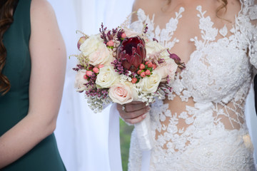Beautiful bride with bridal bouquet in hand