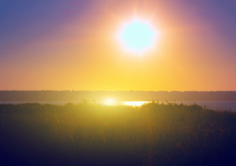 bright morning sun over the lake