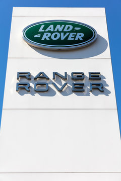 ENGELSKIRCHEN, GERMANY - April 5, 2020: Land Rover/ Range Rover dealership sign against blue sky.