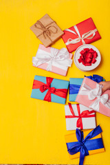lots of gifts for the birthday party on a yellow background