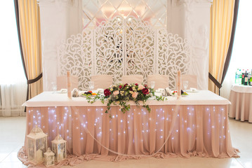 Beautifully decorated wedding table. decorated with roses