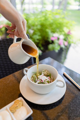 Russian cold soup okroshka on summer terrace