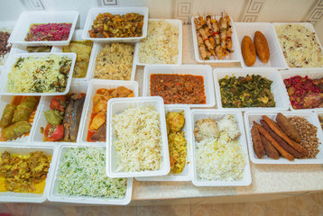 Delivery sets of healthy and delicious food in boxes . A variety of fast food in plastic boxes .