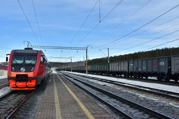 Obraz premium Freight trains from railway station in Ufa, Russia. Railway platform and railway tracks.