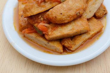 Fishcake fried with tomato sauce in plate