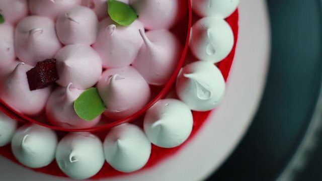 red cake on a mousse stand - raspberry matcha