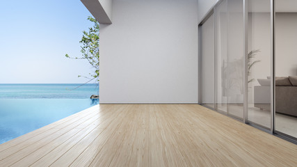 Empty terrace floor near living room and white wall in modern beach house or luxury pool villa. Wooden deck 3d rendering with sea view. - obrazy, fototapety, plakaty
