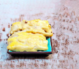 Cannelloni surrounded by rustic background
