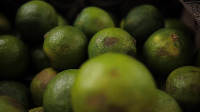 Ripe limes are on the counter of the store. Eco product. Close-up