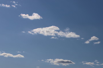 Naklejka na ściany i meble Spring blue sky with clouds. Background of blue sky and clouds.