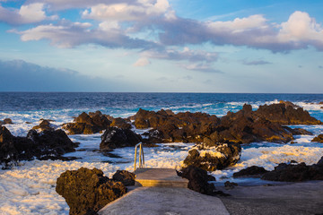 Lava stones on the beach of Piscinas Naturais Biscoitos. Atlantic Ocean. Terceira Azores, Portugal.