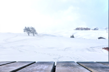 Fototapeta na wymiar Empty wooden base suitable for mockup. Snow background theme.