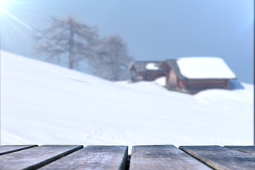 Empty wooden base suitable for mockup. Snow background theme.