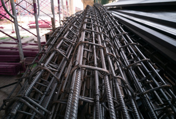 setup DEFORMED BARS STEEL and ROUND BARS STEEL for concrete purlin work, Material on construction site, photo is Depth of field style