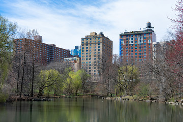 Fototapeta na wymiar Residential Buildings on the Upper West Side surrounding the Pool at the Northern Area of Central Park in New York City during Spring