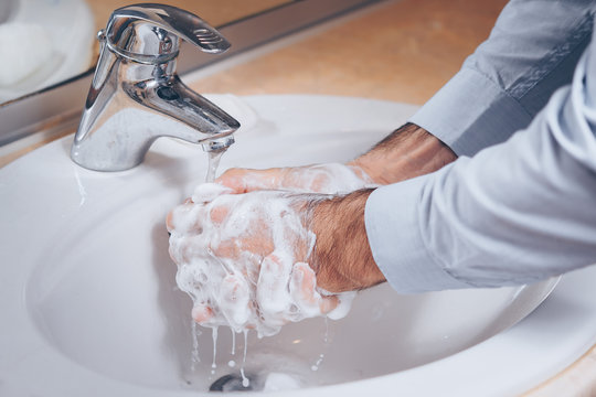 Washing hands rubbing with soap man for corona virus prevention, hygiene to stop spreading coronavirus.