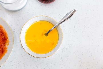 Scrambled eggs and forks in a white bowl