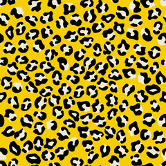 Leopard seamless pattern. Vector animal print. Black and white spots on a yellow background. Jaguar, leopard, cheetah, panther fur. Leopard skin imitation can be painted on clothes or fabric.