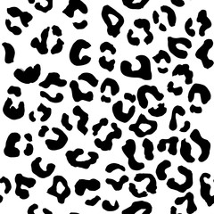 Leopard seamless pattern. Vector animal print. Black spots on a white background. Jaguar, leopard, cheetah, panther fur. Leopard skin imitation can be painted on clothes or fabric.