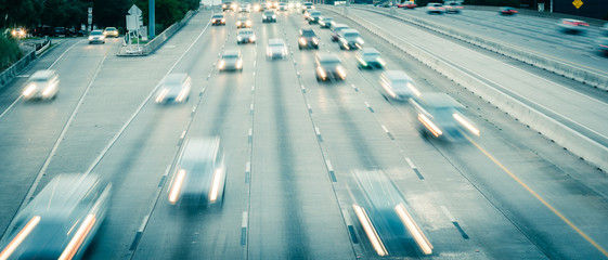 Rush hour traffic on frontage road and Southwest freeway in downtown Houston, USA slow motion