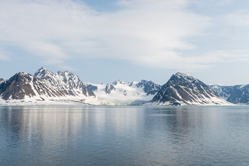 Arctic landscape with mountain and glacier in Svalbard in summer time © Alexey Seafarer
