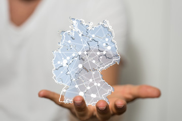 a virtual germany land  map digital in hand 3d