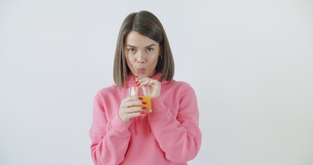 girl in sunglasses drinking juice