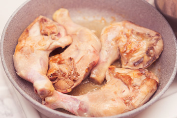 ?hicken legs are fried in oil in a frying pan. Process of cooking, Homemade nutritional recipe