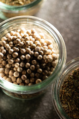 White peppercorn in glass container 