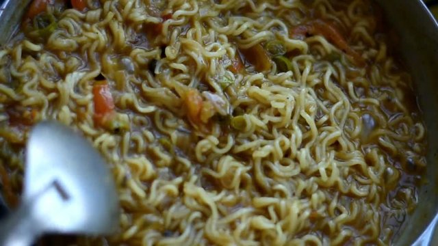 woman making a maggie in indian style, Indian Food