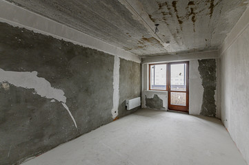 Russia, Moscow- December 15, 2019: interior room rough repair for self-finishing. interior decoration, bare walls of the room, stage of construction