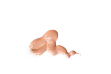 Beige smear of cream sample for a beautiful skin color. Isolate on a white background.