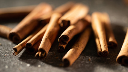 Heap of cinnamon sticks close up