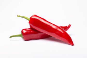 Red sweet capi peppers isolated on white background. Top view